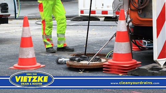 Technician Working on Damaged Sewer